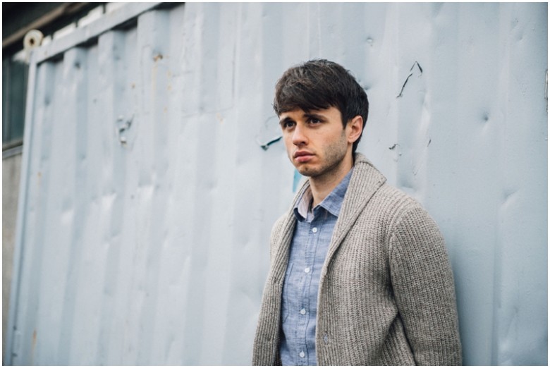 male actor promotional images in an urban setting