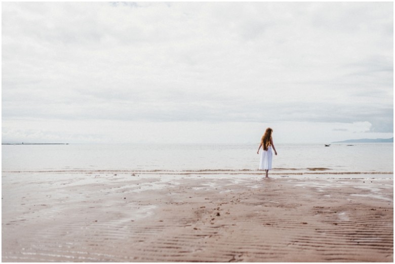 girl walking on a beach