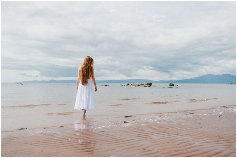 girl walking on a beach