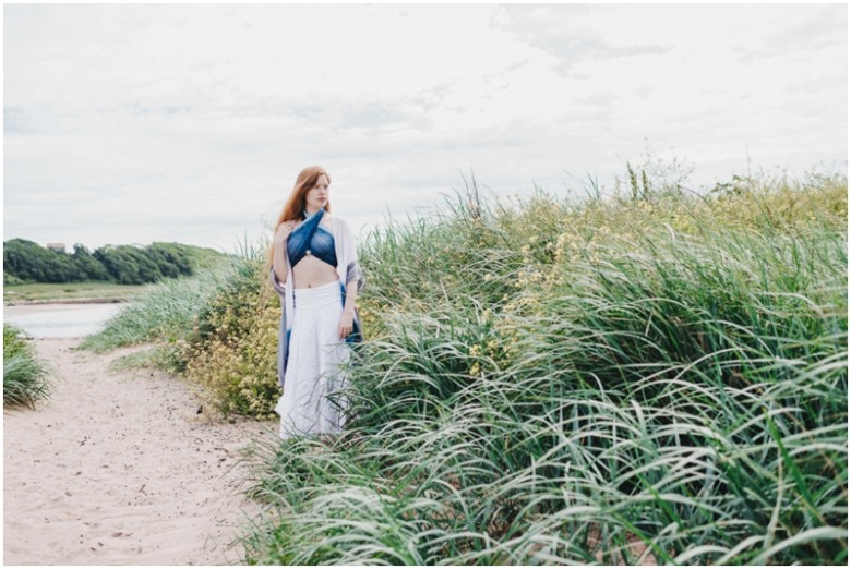 girl in the sand dunes on a beach