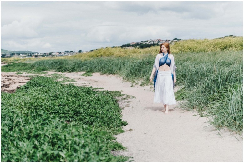 girl in the sand dunes on a beach