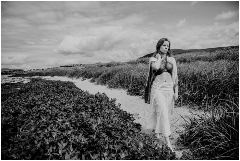 girl in the sand dunes on a beach