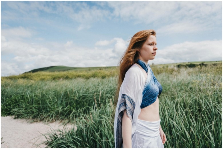 girl in the sand dunes on a beach