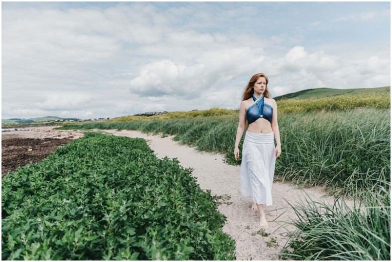 girl in the sand dunes on a beach