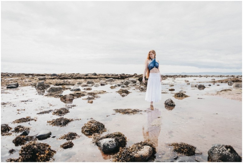 girl standing in the sea at a beach