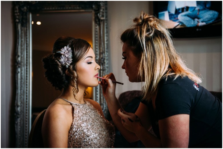 bride and her bridal aprty getting ready