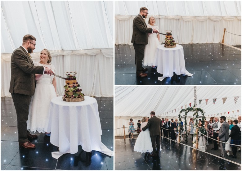 bride and groom cutting their wedding cake